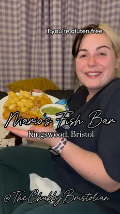 Gluten-free fish and chips with battered sausage, haddock, mushy peas, and large chips from Mario's Fish Bar in Bristol.