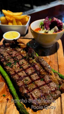 Delicious ribs, calamari, steak frites, and sticky toffee pudding at Rancho Steak House in Poole.