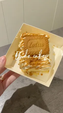 Close-up of a delicious Biscoff cake slice from Dudecake, topped with creamy frosting, perfect for dessert lovers in Bristol.