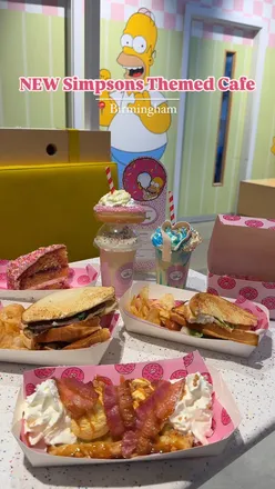 Simpsons themed cafe in Birmingham with Homer doughnuts, sweet treats, waffles, and toasties inside Primark.