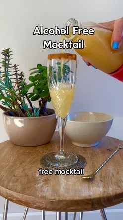Alcohol-free mocktail with apple juice, peony blush tea, cinnamon, lemon, and mint over ice, perfect for Dry January.