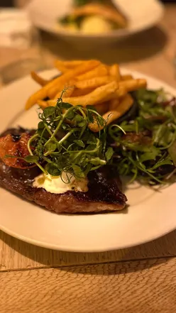 Cozy Ferryman Pub in Lymington with delicious homemade soup, steak, seafood, and warm atmosphere by the fire.