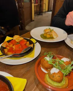 Delicious Spanish dishes at La Casita Penrith: clams with chorizo, meatballs, pork belly, cod fritters, and patatas bravas.