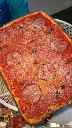 New Haven style pizza with nduja, salami, and pecorino at Civerinos in Finnieston, Glasgow; crispy crust, generous toppings.