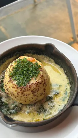 Delicious dishes at The Fox at Oddington: cheese soufflé, beef shin pudding, and wood-fired pizzas in Cotswolds pub.