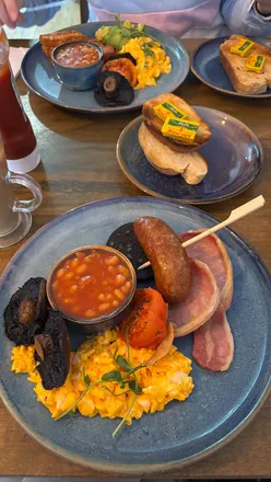 Full English breakfast and vegetarian breakfast at Beau's Kitchen, Bebington, with cappuccino and latte. Farm-to-fork quality.