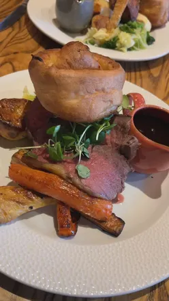 Beef sirloin roast with Yorkshire pudding, thyme potatoes, pork belly, cauli cheese at Harry Cook Freehouse, Cheltenham.