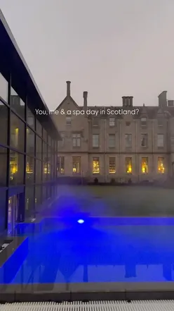 Woman relaxing in outdoor spa at Schloss Roxburghe, Scotland, surrounded by nature, perfect for a 2025 spa day getaway.