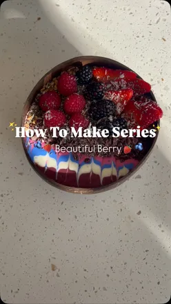 Açaí bowl topped with strawberries, blueberries, raspberries, blackberries, and crunchy toppings, vibrant and nourishing.