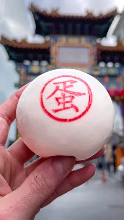 Delicious dishes from top restaurants in London's Chinatown, showcasing vibrant Asian street food options.