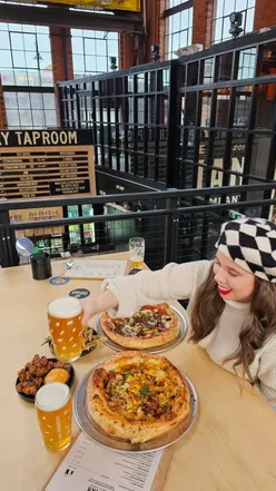 Indian Brewery taproom in Birmingham serving butter chicken pizza, mixed grill pizza, okra fries, and Indian fried chicken.