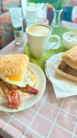 Breakfast baps and flat whites at Norton Cafe, The Mumbles. Enjoy homemade coffee cake, chocolate brownie, and local goods.