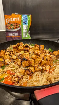 Colorful veggie stir fry with Quorn pieces, noodles, and fresh vegetables, ready in 10 minutes.