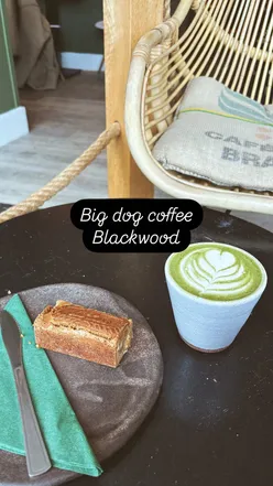 Matcha latte with caramel and lotus blondie at Big Dog Coffee, perfect for coffee and cake lovers.