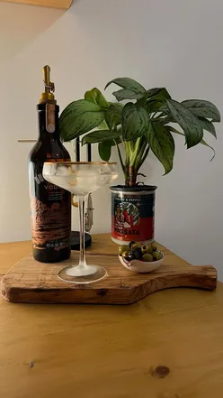 Dry martini with Dutch Barn Vodka on a table, perfect for breaking dry January. Vodka cocktail with a twist.