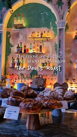 Interior of The Devil's Roast coffee shop in Glasgow with pastries like hazelnut chocolate pain au chocolat and caramel apple Danish.