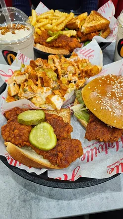 Hotville Oadby: Indulgent Reese's PB and Biscoff milkshakes, spicy Nashville shrimps, crispy chicken sandwich, and loaded fries.