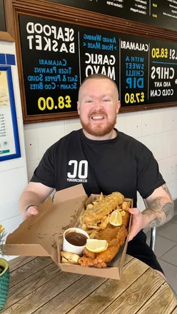 Large cod, chips, and battered sausage from Bishopston Fish Bar, known for award-winning, MSC certified fish and great service.