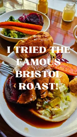 Bristol's famous roast at The Bank Tavern: tender meat, rich gravy, crispy roasties, and pistachio panna cotta dessert.