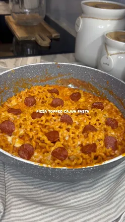Delicious Cajun pasta topped with cheese and pepperoni, a quick and easy midweek meal recipe.