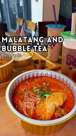 Delicious Malatang bowl with fresh ingredients and Cha Time bubble tea at Wei's Malatang in Leeds.
