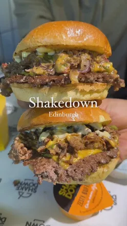Delicious Philly Cheese stack burger with ribeye, peppers, and onions, plus loaded fries and milkshakes.