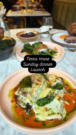 Roasted aubergine with cheese, bruschetta, sirloin steak, burrata, Amalfi lemon tart, and ice cream with espresso at Terra Mare.