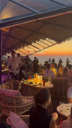 Cocktails and delicious food at Tree Bay Clubhouse, with a stunning sunset view in Kata, Phuket, Thailand.