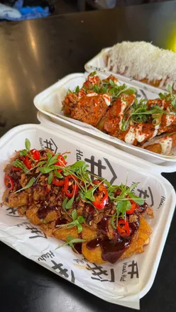 Loaded hash browns topped with truffle Parmesan, fried chicken, and Korean BBQ pork at Hash Hut, Old Spitalfields Market.