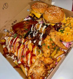 King of Kings Box at BRGR Bridgend with classic burger, funky chicken, BBQ ribs, wings, tenders, chorizo mac, and peri peri fries.