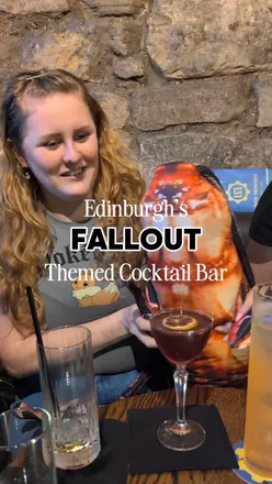 Colorful Fallout-themed cocktails and decor at The Cocktail Geeks bar in Edinburgh, showcasing vibrant Nuka Colas.