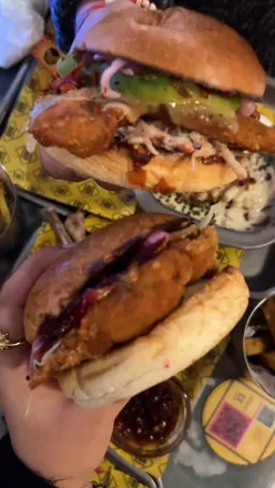 Delicious Mexican-themed burgers with avocado, chicken, and vibrant toppings at GBK Burgers, Trafford Centre.
