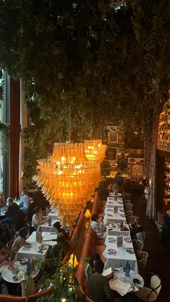 Delicious Italian dishes at La Belezza: truffle arancini, creamy burrata, aged sirloin, and crispy roast potatoes.