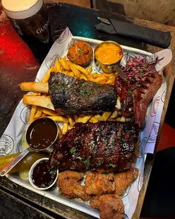 Cane and Grain's Monday 50% off: House bones tray with ribs, chicken wings, maple bacon, katsu fries, and cauliflower wings.
