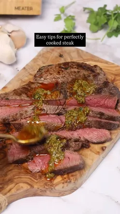 Perfectly cooked steak with Cowboy Butter, showcasing cooking tips and a Meater thermometer for steak lovers.