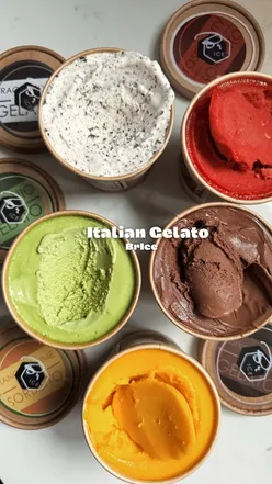 A scoop of pistachio gelato in a cone, perfect for spring sunshine and made with natural ingredients.