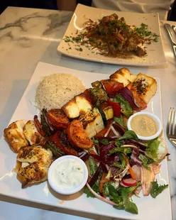 Authentic Cypriot restaurant Cyprus Inn in Stalybridge offers mezze platters, halloumi skewers, Paphos kebab, and pistachio cake.