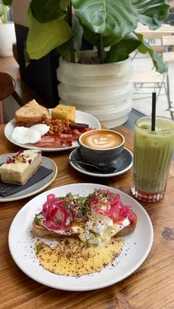 Brunch spread at York's Cafe: Arabian buttered eggs, Persian love cake, house breakfast, and strawberry iced matcha.