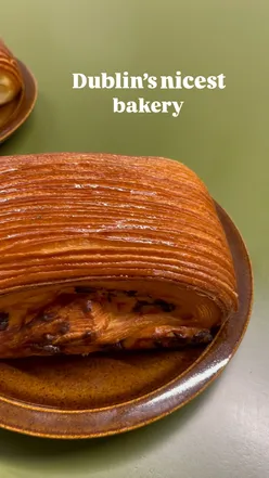 Two pain suisse pastries and coffee at Elliot's in Smithfield, Dublin, showcasing delicious bakery treats.