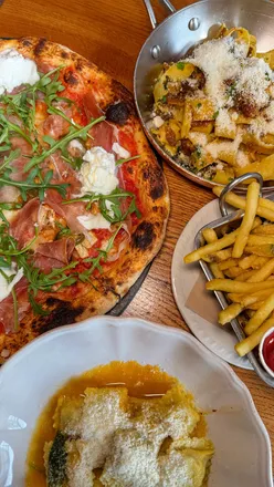 Delicious Italian dishes at Livin Italy in Leeds: Beef Ragu, Lamb Plin Raviolini, and custom pizza with fresh toppings.