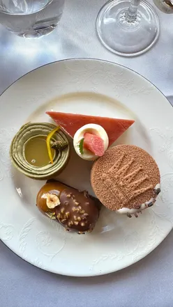 Royal Afternoon Tea at Rubens: smoked salmon sandwiches, scones, and spring desserts with black tea.