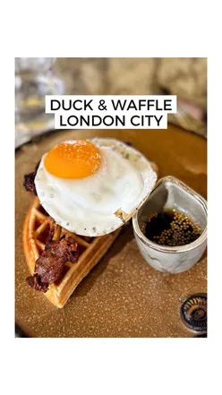 Delicious Duck & Waffle brunch with cocktails, featuring crispy duck, Colombian eggs, and poached avocado toast.