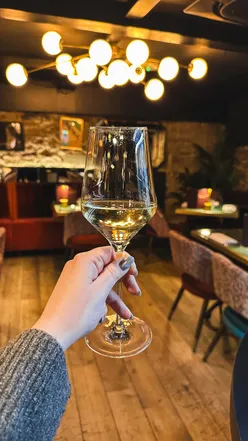 Enomatic wine dispenser at Divino Edinburgh, offering rare wine tasting by the glass in a cozy Italian restaurant.