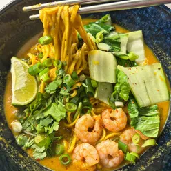 Homemade Malaysian laksa with prawns and noodles, capturing a cozy winter vibe in Bristol.