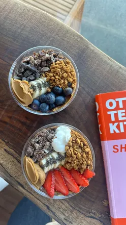 Delicious acai bowl topped with fresh fruits and granola at Winnie and the Wave, Newquay, Cornwall.