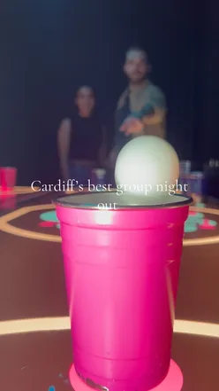Enjoying 2-4-1 cocktails and games at Boom Battle Bar during happy hour in Cardiff, featuring tasty food options.