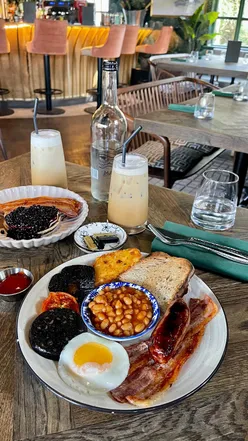 Brunch spread at The Bracebridge in Sutton Park, showcasing fresh dishes and vibrant spring scenery.