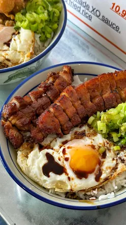 Delicious char siu rice bowl topped with a sunny side egg at Lojomate, Manchester's hidden gem for HK cuisine.
