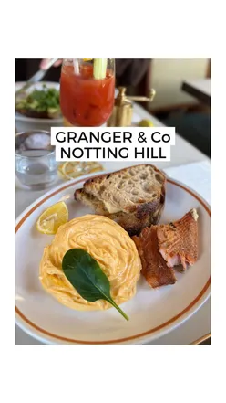 Brunch at Granger & Co in Notting Hill: fluffy scrambled eggs, ricotta hot cakes, and drinks including Bloody Marys.
