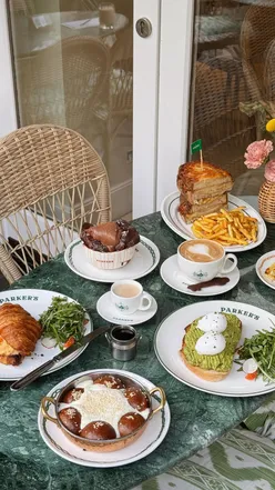 Delicious brunch spread at Parker's London featuring babka French toast, croque monsieur, and Matilda chocolate cake.